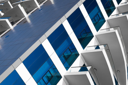 A modern office or hotel building with a mirrored blue facade