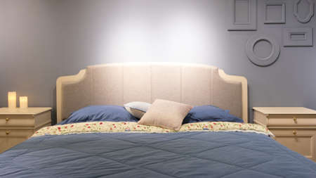 Big comfortable bed in hotel roomの写真素材