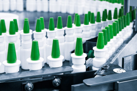 Close-up Many white plastic spray bottles for packaging liquid medicines or cosmetics in a row on a...