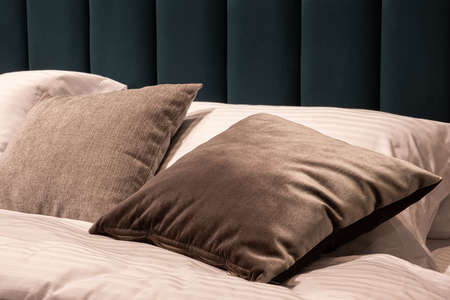 Big comfortable bed in hotel roomの写真素材