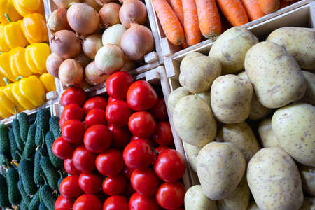 big choice of fresh fruits and vegetables on market counterの写真素材