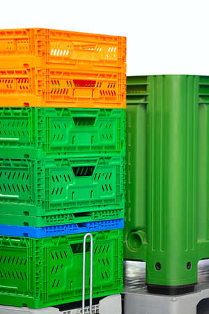 Colorful plastic boxes isolated on white background, logistics conceptの写真素材
