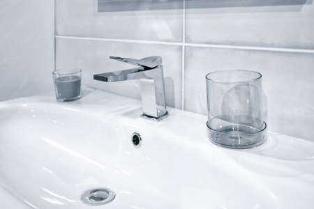 Bathroom interior with white sink and faucetの写真素材