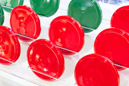 Bright red and green tin screw caps for glass jar backgroundの写真素材