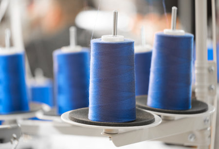 Blue reels of threads industry background, Spools of colored cotton thread, ordered compositionの写真素材
