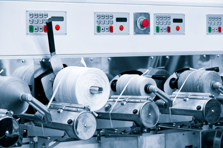 Sewing equipment, loom equipment at a garment factory, industrial concept background