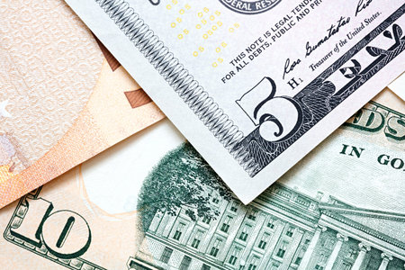International currencies background. Money from different countries: dollars, euros.