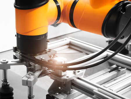 Modern robotic industrial technology concept, Automated CNC machine loading with robotic arm....