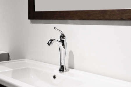 Bathroom interior with sink and faucet.の写真素材