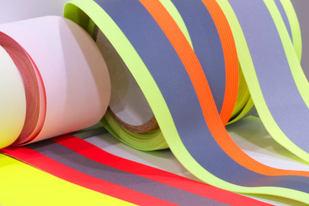 a set of a number of coils of satin ribbons in different colors for the label or decoration backgroundの写真素材