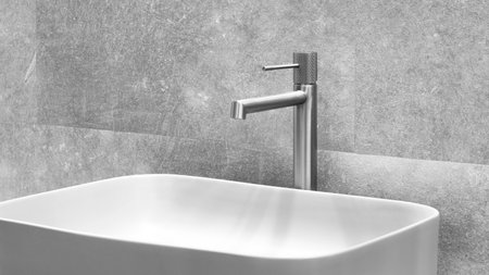 Washbasin with faucet in minimalist modern bathroom, gray bathroom interiorの写真素材