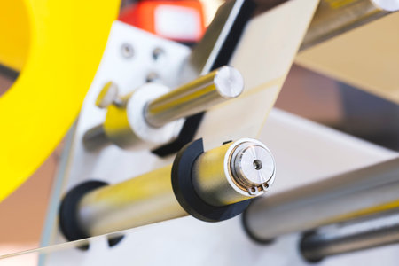 Fragment of the conveyor of sticking labeling machine. Abstract industrial background.の写真素材