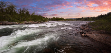 Vintage landscape with a mountain river. Sunset sky over river landscape, nature background