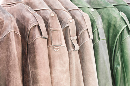 Multicolored leather jackets in the marketの写真素材