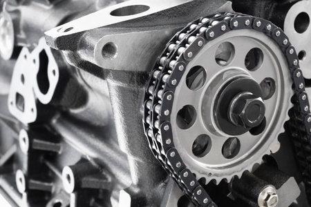 new car timing chain on a disassembled engine in a car workshop. Timing chain in internal combustion...