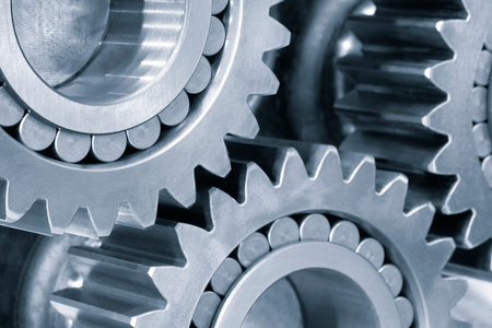 Car planetary gear with 5 satellite cog wheels in opened gearbox, industrial concept backgroundの写真素材