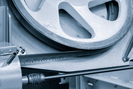 The automatic band saw machine cutting the metal bar with coolant method. The machine tool for industrial purpose.の写真素材