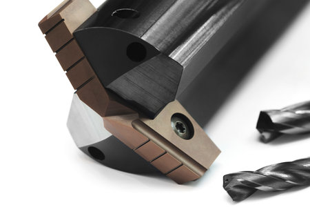 drilling milling metal cutting tool with carbide cutter insert in workshop. Drills with...