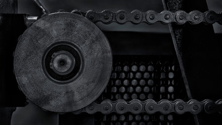 Gear chain drive shaft in conveyor belt is on production line. Timing chain of car, tensioners in...