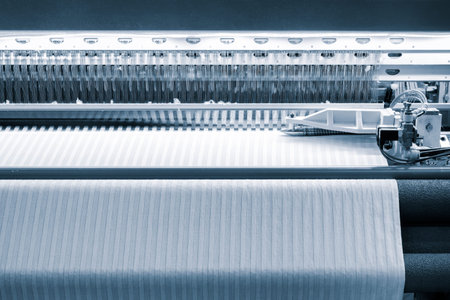 Industrial textile weaving machine in a weaving factory, industrial concept background