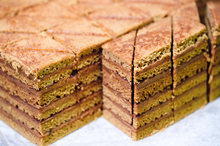 A stack of brownies with a crosshatch pattern. The brownies are cut into squares and arranged in a...