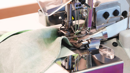 Professional sewing machine and sews garments, textile fabric production industrial concept backgroundの写真素材