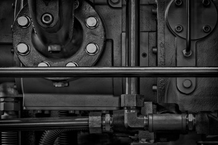 A close up of a machine with many bolts and nuts. Concept of complexity and complexity, as well as the importance of the machine's inner workingsの写真素材