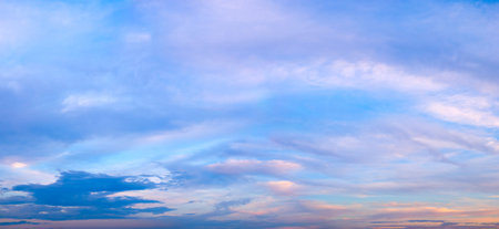 Beautiful sky sunset with red clouds on blue backgroundの写真素材