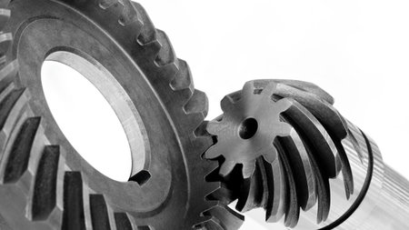 A gear with a hole in the middle. The gear is blackの写真素材