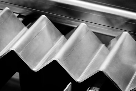 Metal products bend on a bending machine. Factory made products. Industrial concept background....