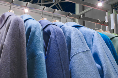 Rask colorful clothes hang on slotneslene. The colors are bright and cheerful, create a feeling of warmth and comfortの写真素材