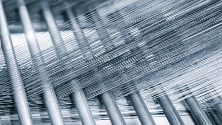 Multicolored straight strands texture background, sewing equipment, loom equipment at a garment factoryの写真素材