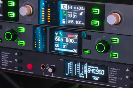 A green and black electronic device with a screen displaying the time of 6:30. The device is likely...