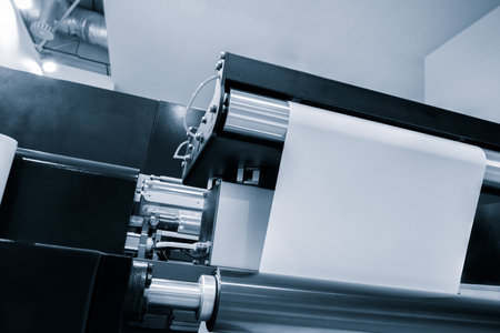 Automatic polyethylene plastic bag production machine with lighting effect. Close-up of the roller of the plastic bag production machine in the light blue scene. product packaging conceptの写真素材
