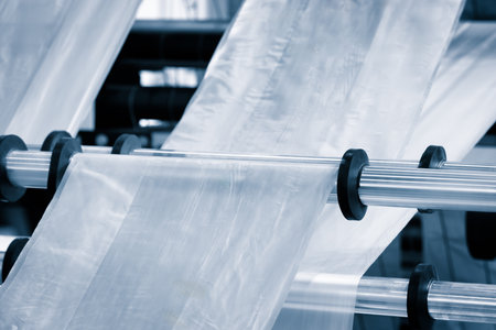 Industrial machine for production and printing of polyethylene bags. Industrial concept backgroundの写真素材
