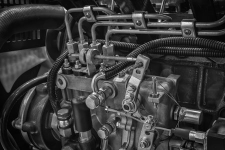 Big diesel engine close up feed from the side, industrial service engine concept background