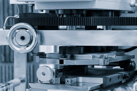 Manufacturing machine with control handles and gear transmission, industrial concept background
