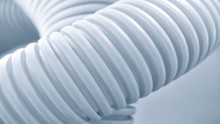 A white tube with a spiral shape. The tube is made of plastic and is white in color