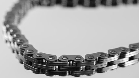 Close-up of car engine timing chain links, car service concept backgroundの写真素材