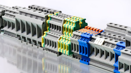 A row of electrical connectors with different colors and sizes. Concept of organization and variety,...