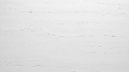 White texture plaster plaster stone background with a smooth surface with small pits. abstract texture background for template pages and banners.の写真素材