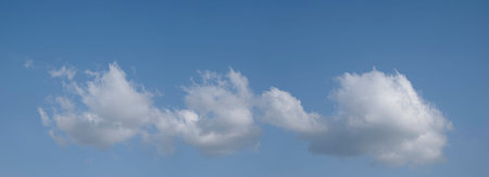 heaven sky is blue with many clouds. clouds are scattered throughout the sky and are of various...