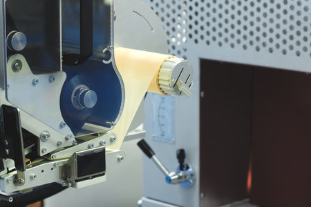 Fragment of the conveyor of sticking labeling machine. Abstract industrial background.の写真素材