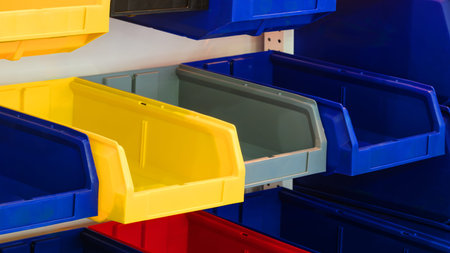 Plastic trays in a warehouse for assembling orders of small items, logistics delivery concept