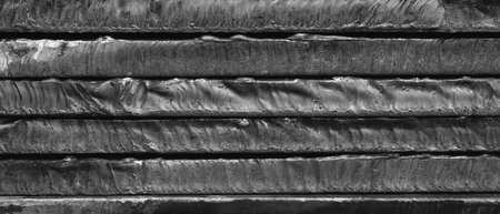 Stack of metal sheets with rust. plates are stacked on top of each other and have traces of laser...