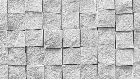 White wall with black squares. squares are of different sizes. wall is made of stone, abstract...