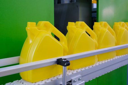 Large industrial PVC extrusion machine for producing plastic liquid canisters.の写真素材