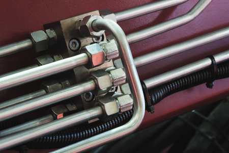 Bundle of pipes connected to industrial hydraulic pneumatic machine, industrial concept background