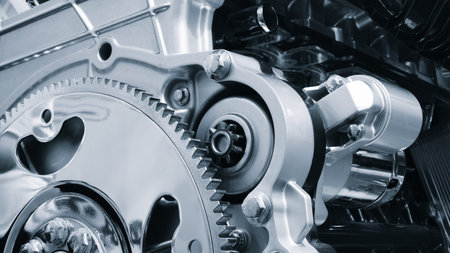 Shown is a large engine with many tubes, bolts and various parts. Auto service concept background