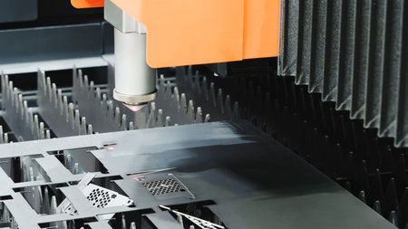 Industrial machine laser cutting metal, industrial concept background.